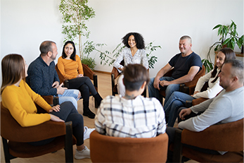 group of people sitting in a circle
