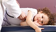 Doctor checking childs heartbeat Doctor checking childs heartbeat