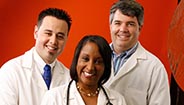 Three doctors smiling