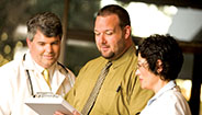 Doctors looking at patients record