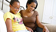Mother and daughter smiling